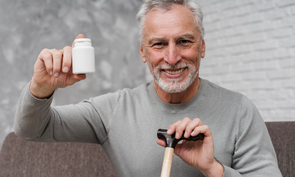 Older adult holding a natural supplement bottle to support bone health, healthy ageing, mobility, and an active lifestyle.
