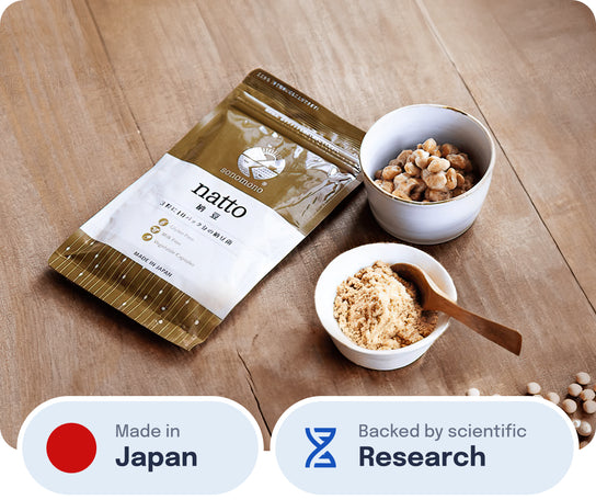 sonomono™ Natto powder capsules on a wooden table