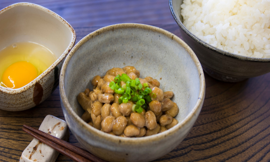 Japanese natto with rice and egg, a fermented food rich in probiotics that supports gut microbiome health.