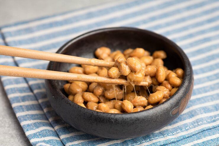 Japanese natto fermented soybeans with sticky texture served in a bowl, known for gut health and heart health benefits