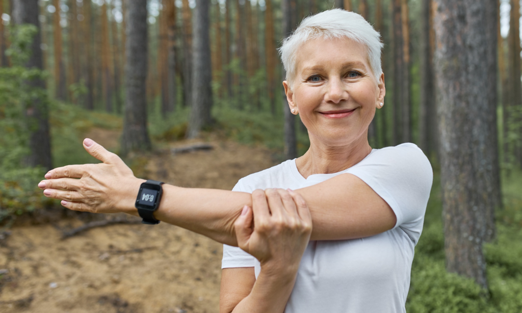 Active older woman stretching outdoors, representing bone health supported by vitamin K2 (MK-7) found in natto.